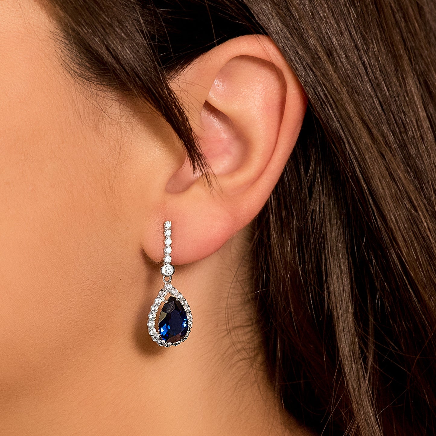 18K PENDIENTES ORO BLANCO DOS CUERPOS CON PIEDRA AZUL 12 X 8MM. 33X12MM